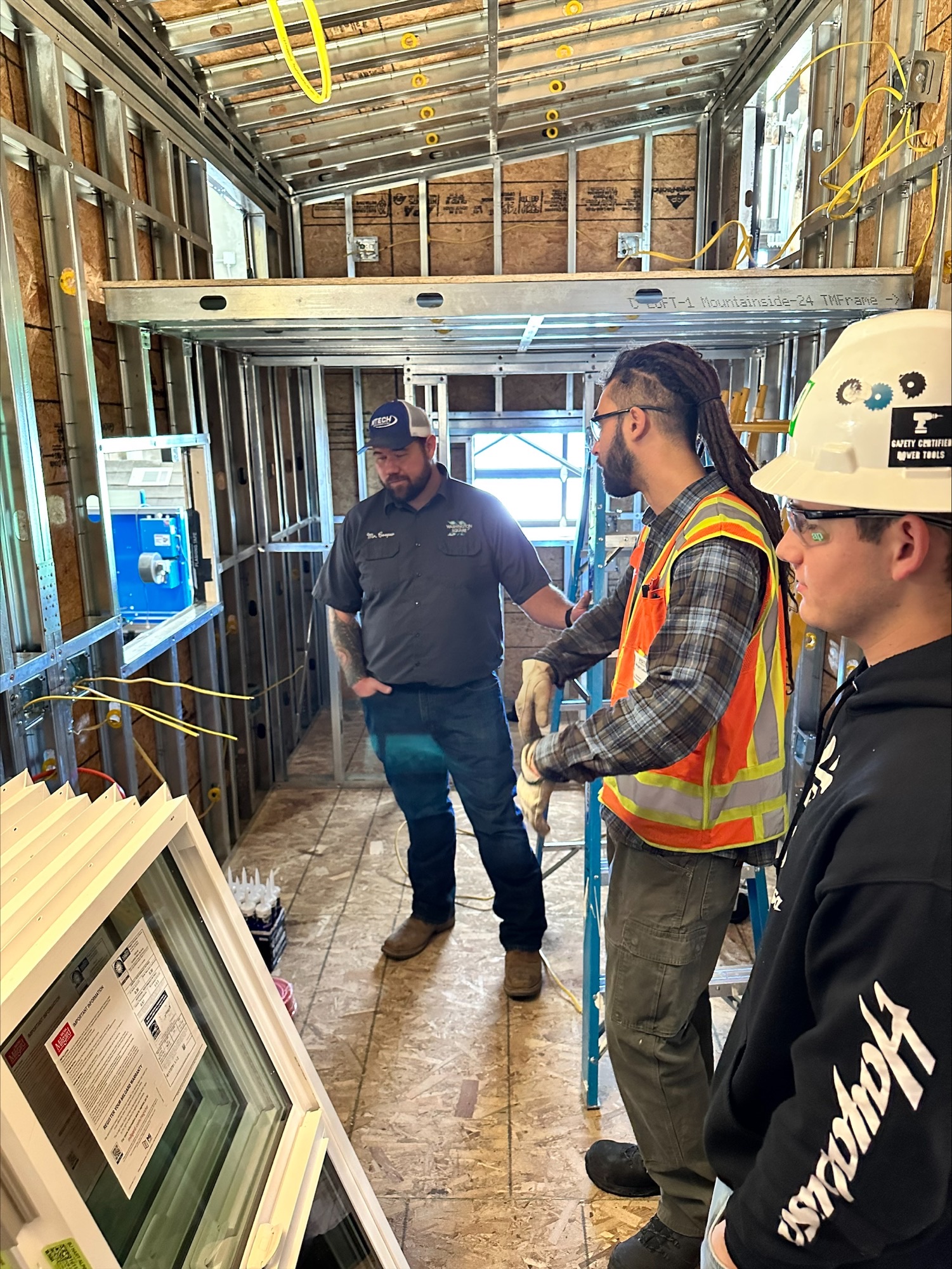 Kenny inspects work for tiny homes.